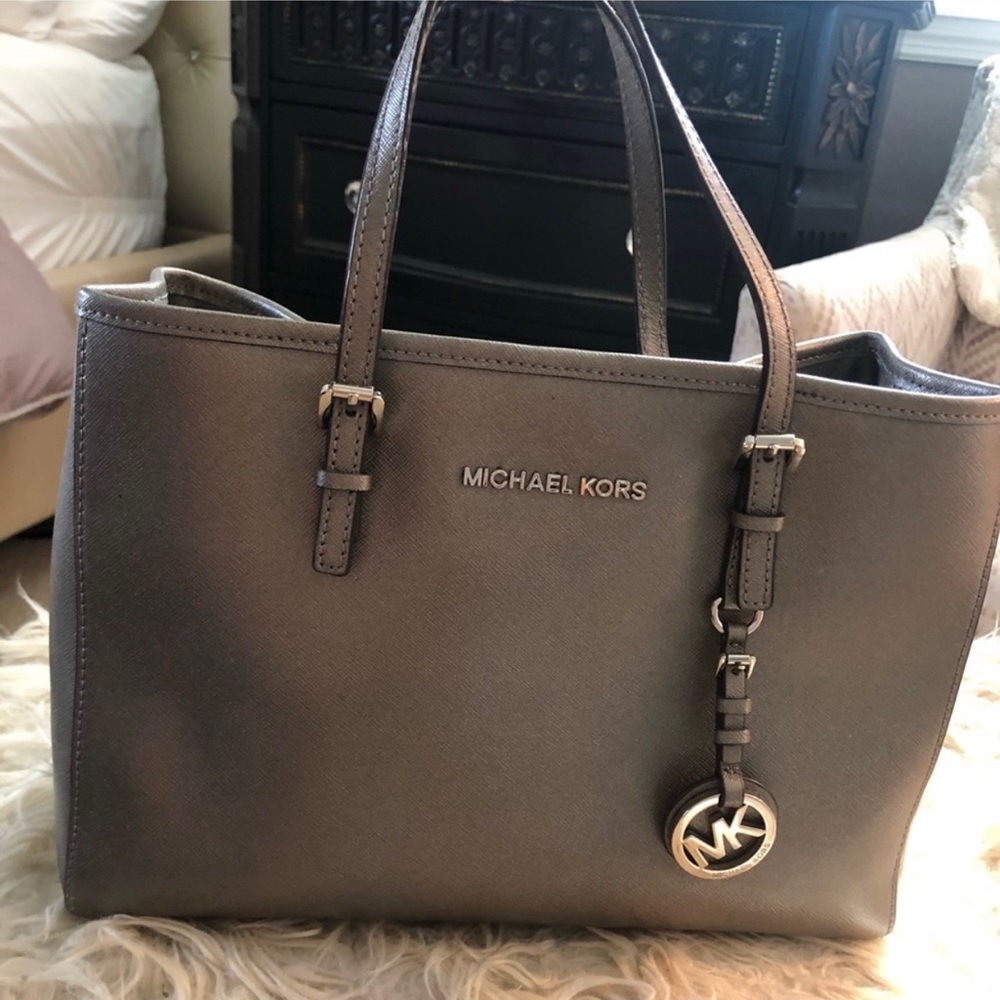 Michael Kors silver purse.